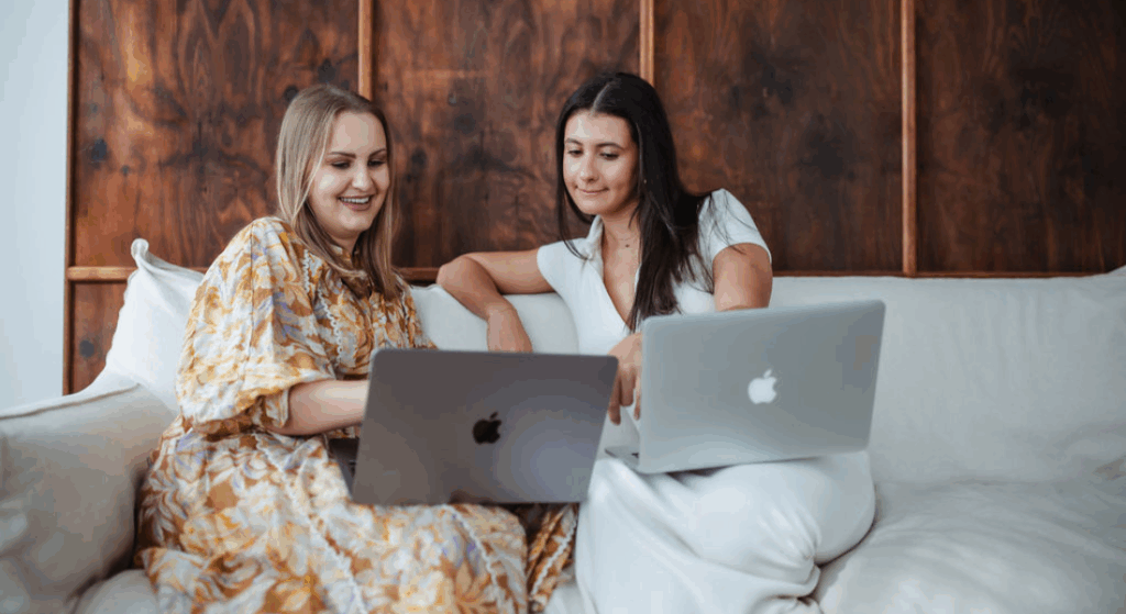 Event team planning a Black Friday brand activation using laptops and notepads.