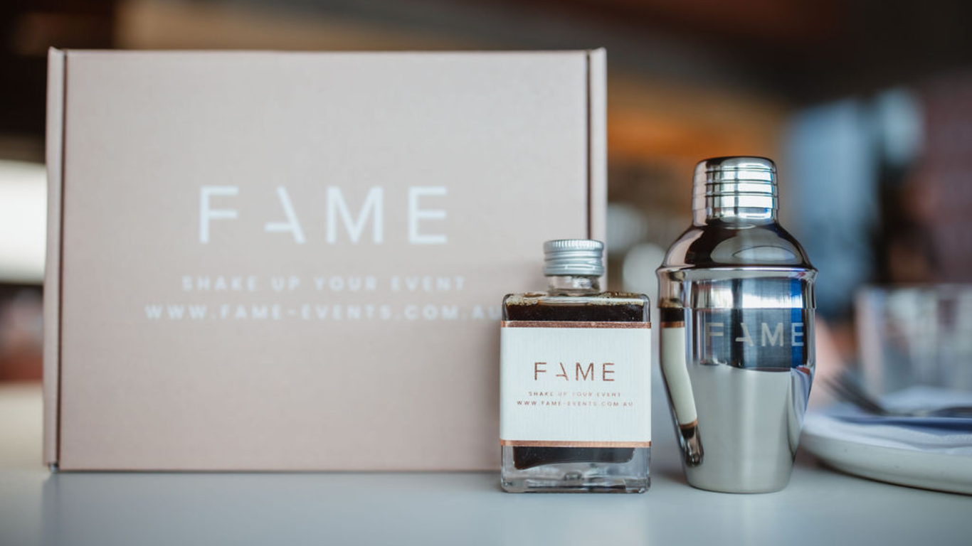 Branded corporate event invite featuring cocktail-themed elements and personalised touches.